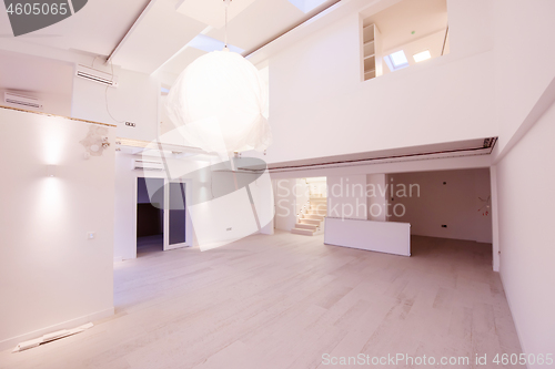 Image of Interior of empty stylish modern open space two level apartment