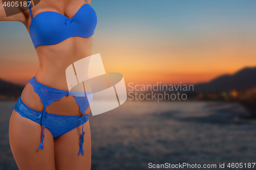 Image of Slim beautiful woman on sunset sea