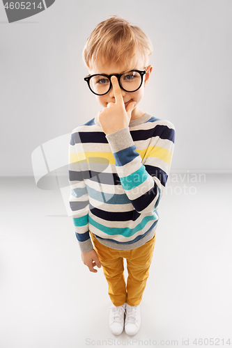 Image of smiling boy in glasses and striped pullover