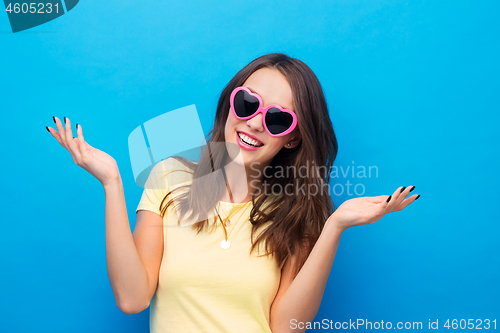 Image of teenage girl in heart-shaped sunglasses