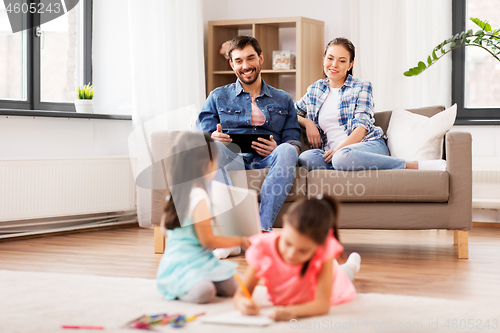 Image of happy family spending free time at home