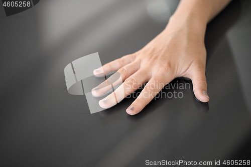 Image of hand using black interactive panel