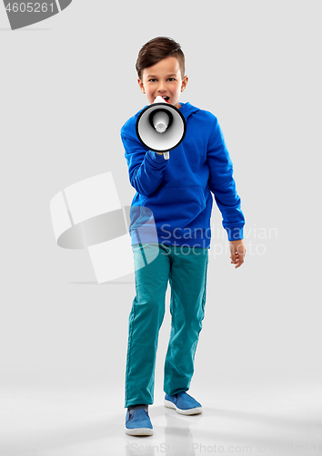 Image of smiling boy speaking to megaphone