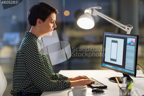 Image of graphic designer with computer working at office