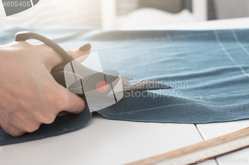 Image of Designer Cutting Fabric