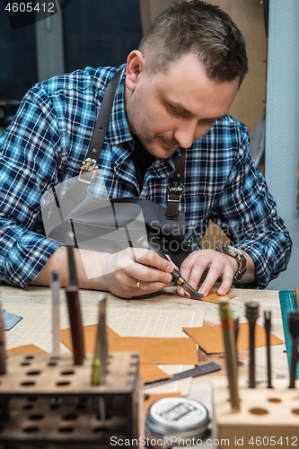 Image of Concept of handmade craft production of leather goods.