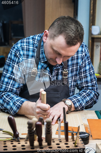 Image of Concept of handmade craft production of leather goods.