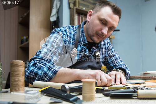 Image of Concept of handmade craft production of leather goods.