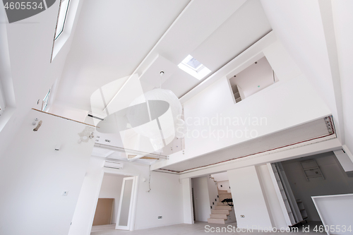 Image of Interior of empty stylish modern open space two level apartment