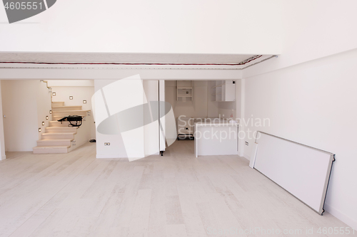 Image of Interior of empty stylish modern open space two level apartment