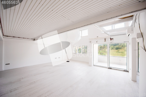 Image of Interior of empty stylish modern open space two level apartment