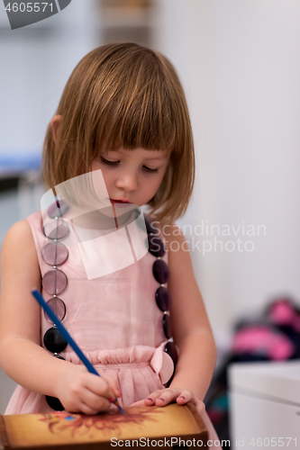 Image of little girl painting jewelry box