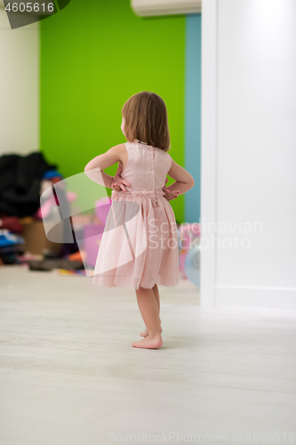 Image of portrait of little cute girl playing at home