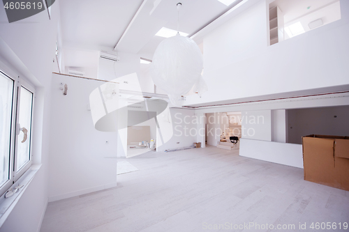 Image of Interior of empty stylish modern open space two level apartment