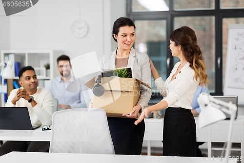 Image of new female employee meeting colleagues at office