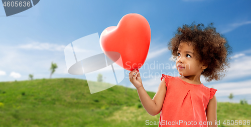 Image of african american girl with heart shaped balloon