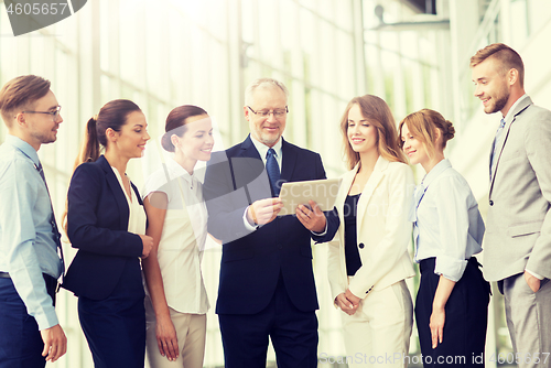 Image of business people with tablet pc computer at office