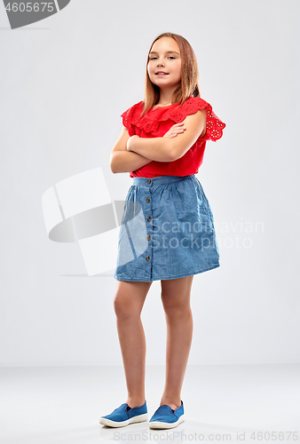 Image of beautiful smiling girl with crossed arms