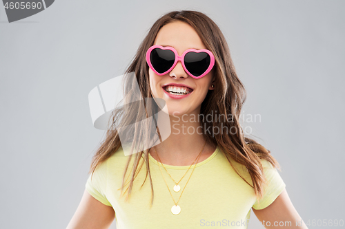 Image of teenage girl in heart-shaped sunglasses