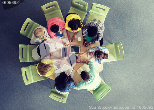 Image of group of students with tablet pc at school library