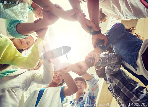 Image of group of international students holding hands