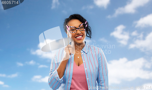 Image of happy african american woman with big glasses