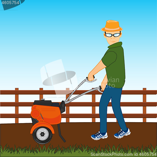 Image of Man with walking tractor works at area