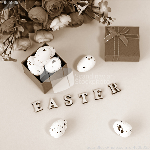 Image of Festive Easter card with a bouquet of roses and a red box