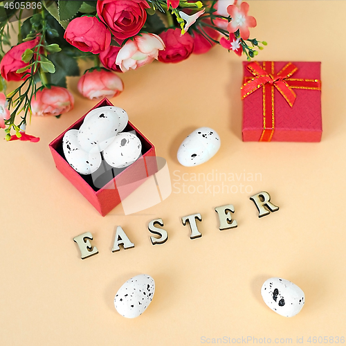 Image of Festive Easter card with a bouquet of roses and a red box