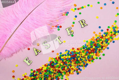 Image of Abstract easter card with scattered color confectionery balls and letters. Easter holiday concept.