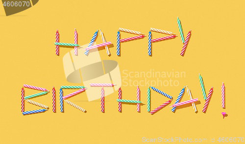 Image of Greeting text Happy Birthday handmade from colorful candles.