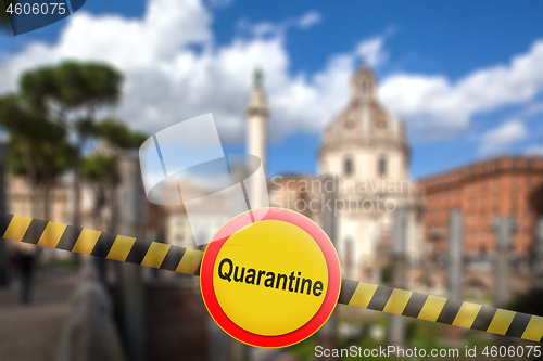 Image of Warning sign of quarantine on the blurred background of Rome City, Italy.