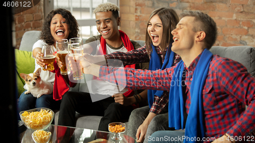 Image of Excited group of people watching sport match, championship at home