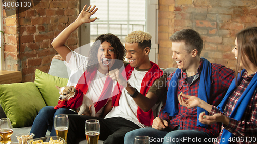 Image of Excited group of people watching sport match, championship at home