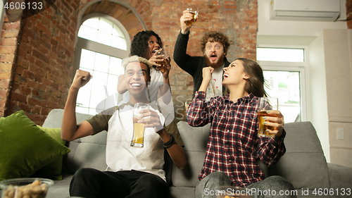 Image of Excited group of people watching sport match, championship at home