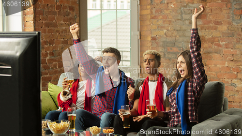 Image of Excited group of people watching sport match, championship at home