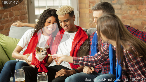 Image of Excited group of people watching sport match, championship at home