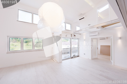 Image of Interior of empty stylish modern open space two level apartment