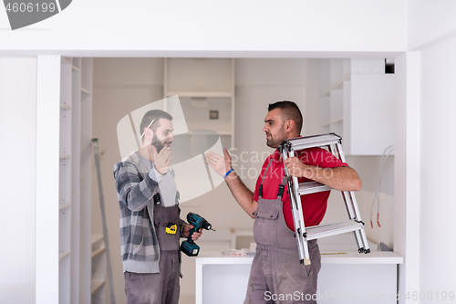 Image of workers giving high five to each other