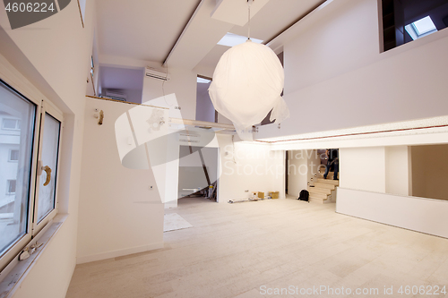 Image of Interior of empty stylish modern open space two level apartment