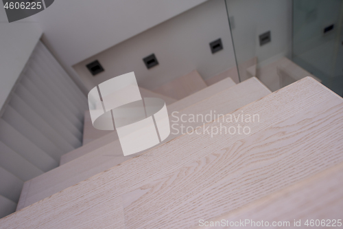 Image of stylish interior with wooden stairs