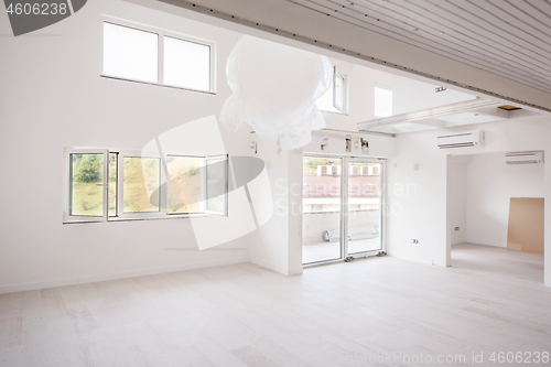 Image of Interior of empty stylish modern open space two level apartment