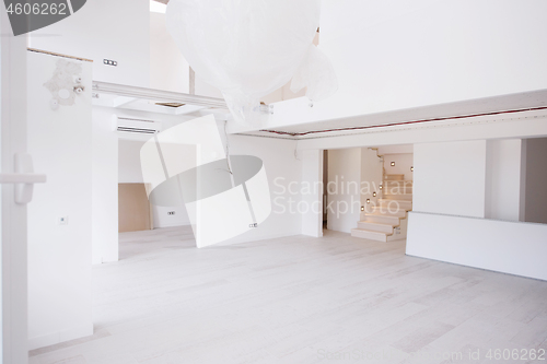 Image of Interior of empty stylish modern open space two level apartment