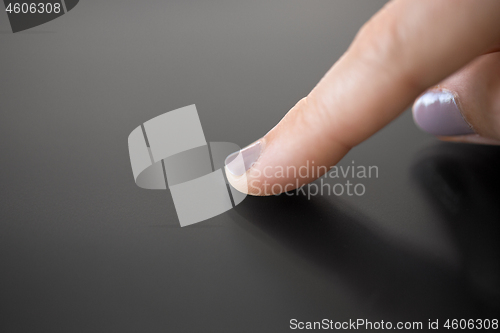 Image of hand using black interactive panel