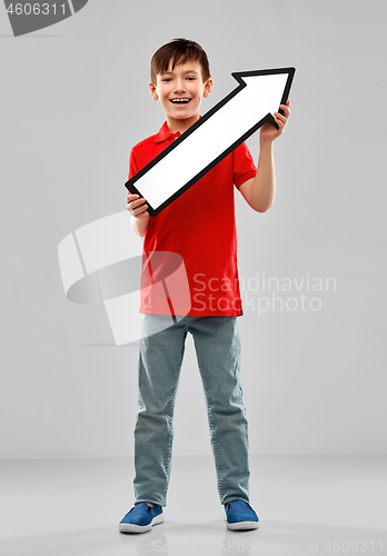 Image of boy holding big white upwards thick arrow