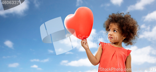 Image of african american girl with heart shaped balloon