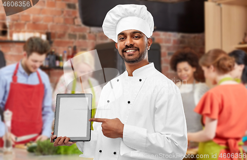 Image of indian chef with tablet computer at cooking class