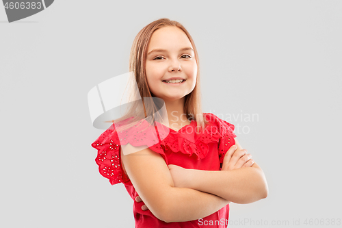 Image of beautiful smiling girl with crossed arms