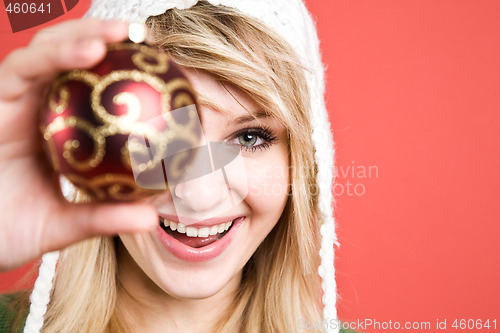 Image of Caucasian girl with christmas ornament