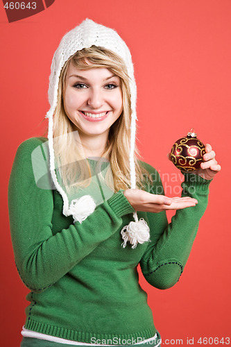 Image of Caucasian girl with christmas ornament